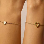 Matching Hearts Bracelet — solid and hollow heart bracelets that fit together, a mother and daughter set